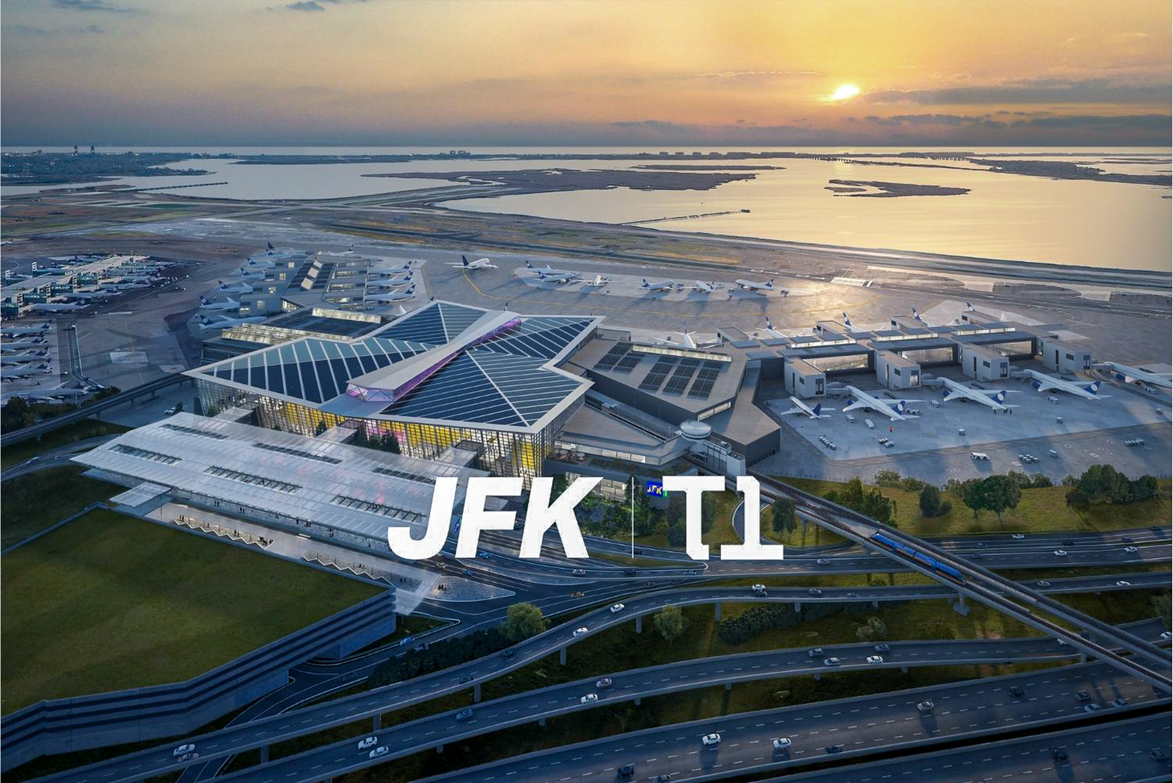 ภาพถ่ายทางอากาศมุมสูงของโครงการ New Terminal One (NTO) หรืออาคารผู้โดยสาร 1 (JFK T1) แสดงสถาปัตยกรรมหลังคาโค้งขนาดใหญ่และผังอาคารโดยรวม