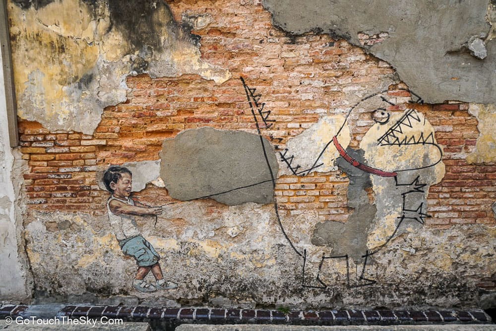 Little Boy with a Pet Dinosaur Street Art